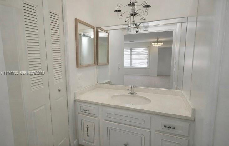 3531 Inverrary Drive, Unit 310 Lauderhill, FL 33319 - Photo 10 of 10 a bathroom with a sink vanity and mirror