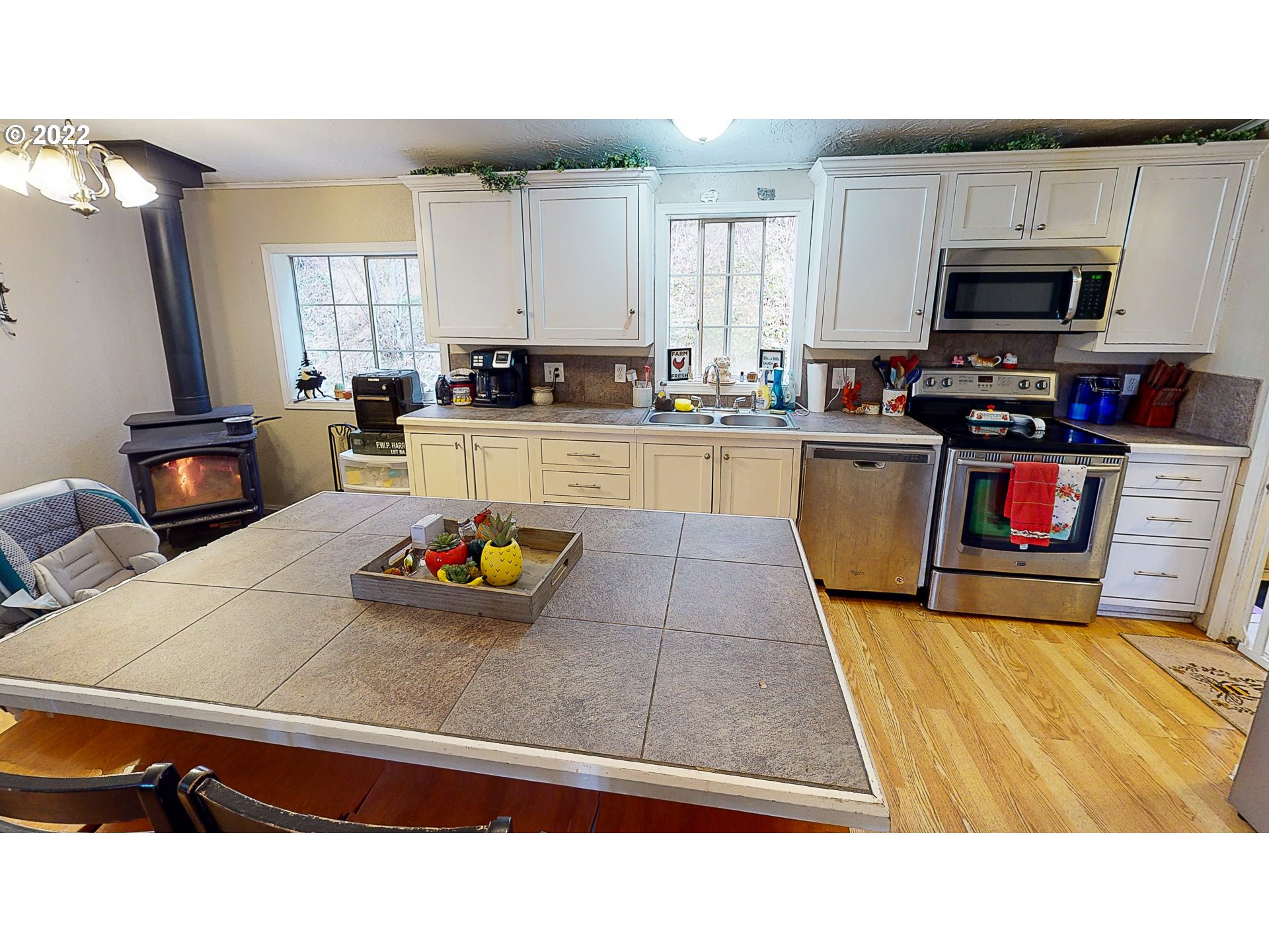 377 P G Sweet Road Kelso, WA 98626 - Photo 12 of 29 a kitchen with sink a stove and cabinets