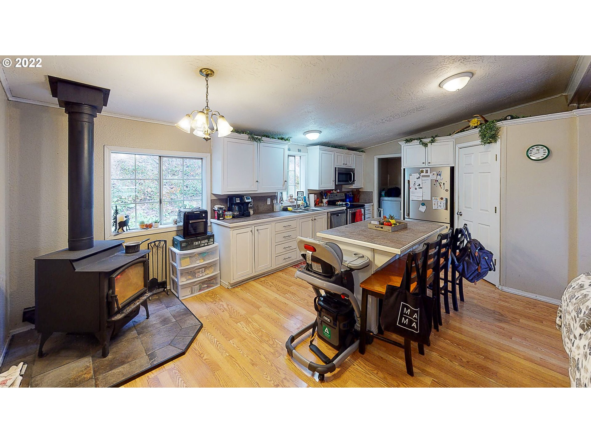 377 P G Sweet Road Kelso, WA 98626 - Photo 13 of 29 a living room with stainless steel appliances kitchen island granite countertop furniture and a kitchen view
