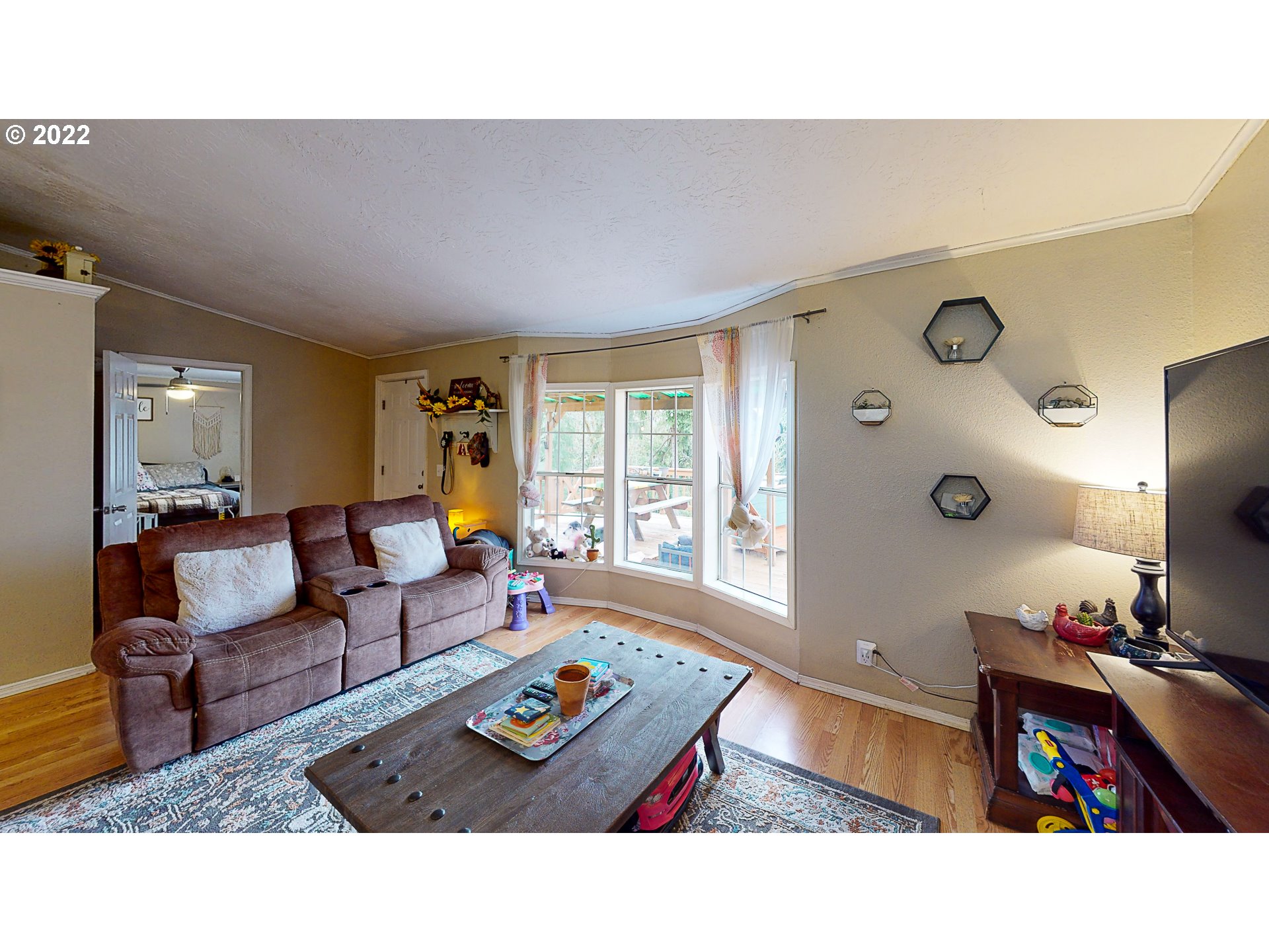 377 P G Sweet Road Kelso, WA 98626 - Photo 10 of 29 a living room with furniture and a flat screen tv
