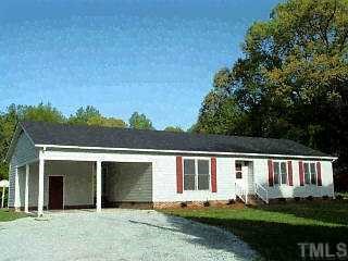 7600 Blalock Road Bahama, NC 27503 - Photo 1 of 1 front view of a house with a yard
