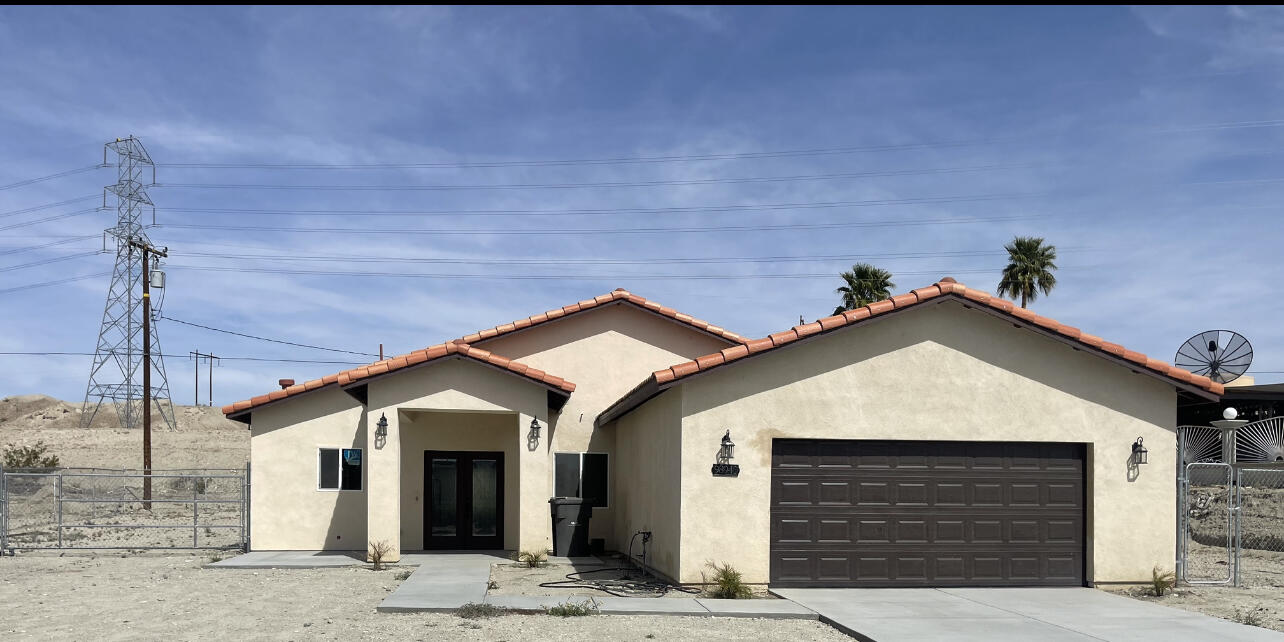 a view of a house with a garage