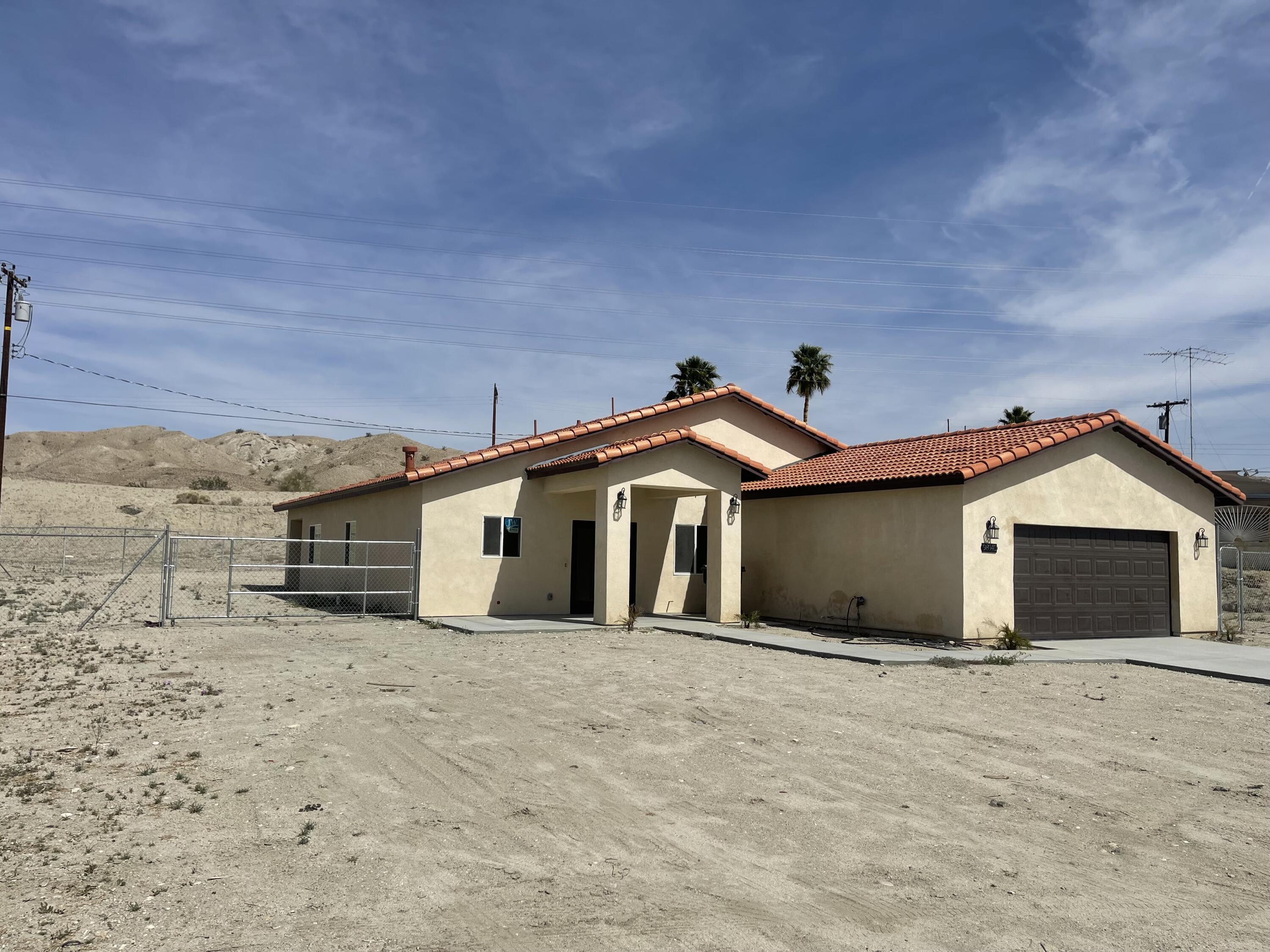 Undisclosed Address Mecca, CA 92254 - Photo 2 of 10 a view of a house with a yard