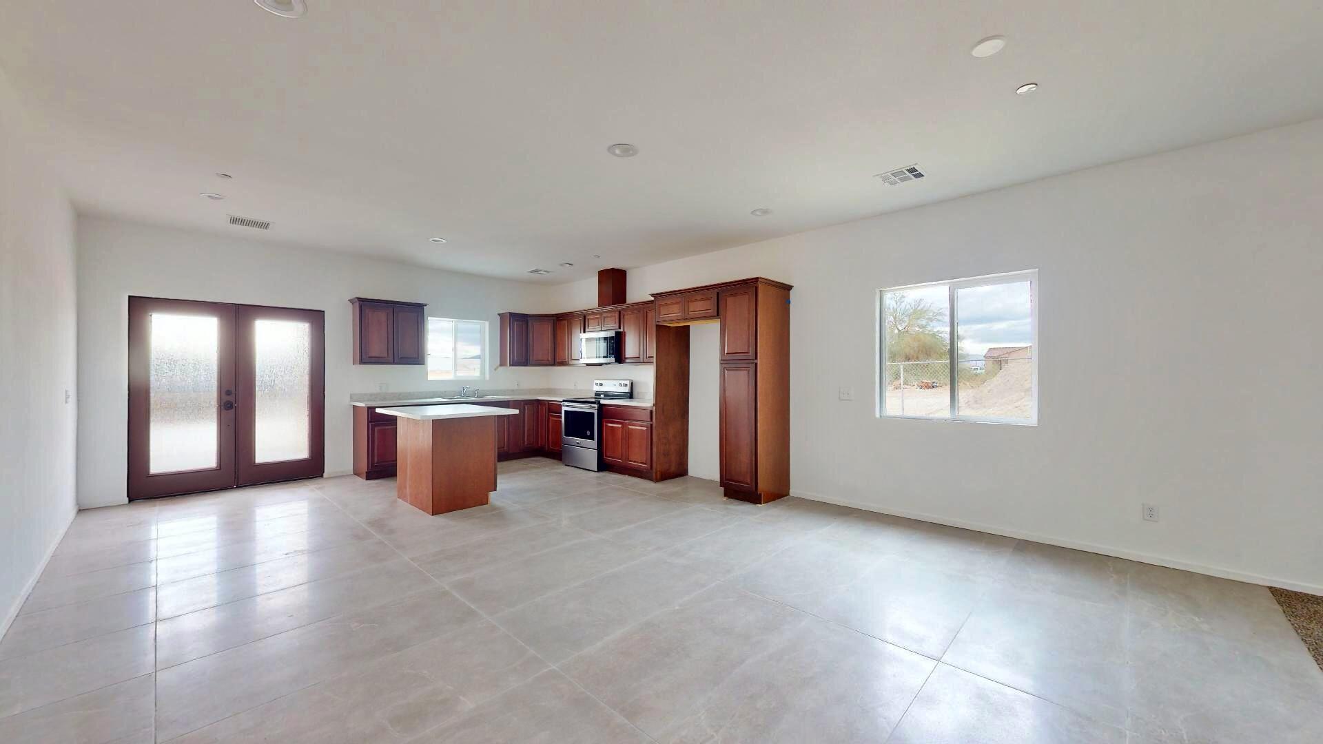 Undisclosed Address Mecca, CA 92254 - Photo 5 of 10 a large kitchen with a refrigerator and a sink