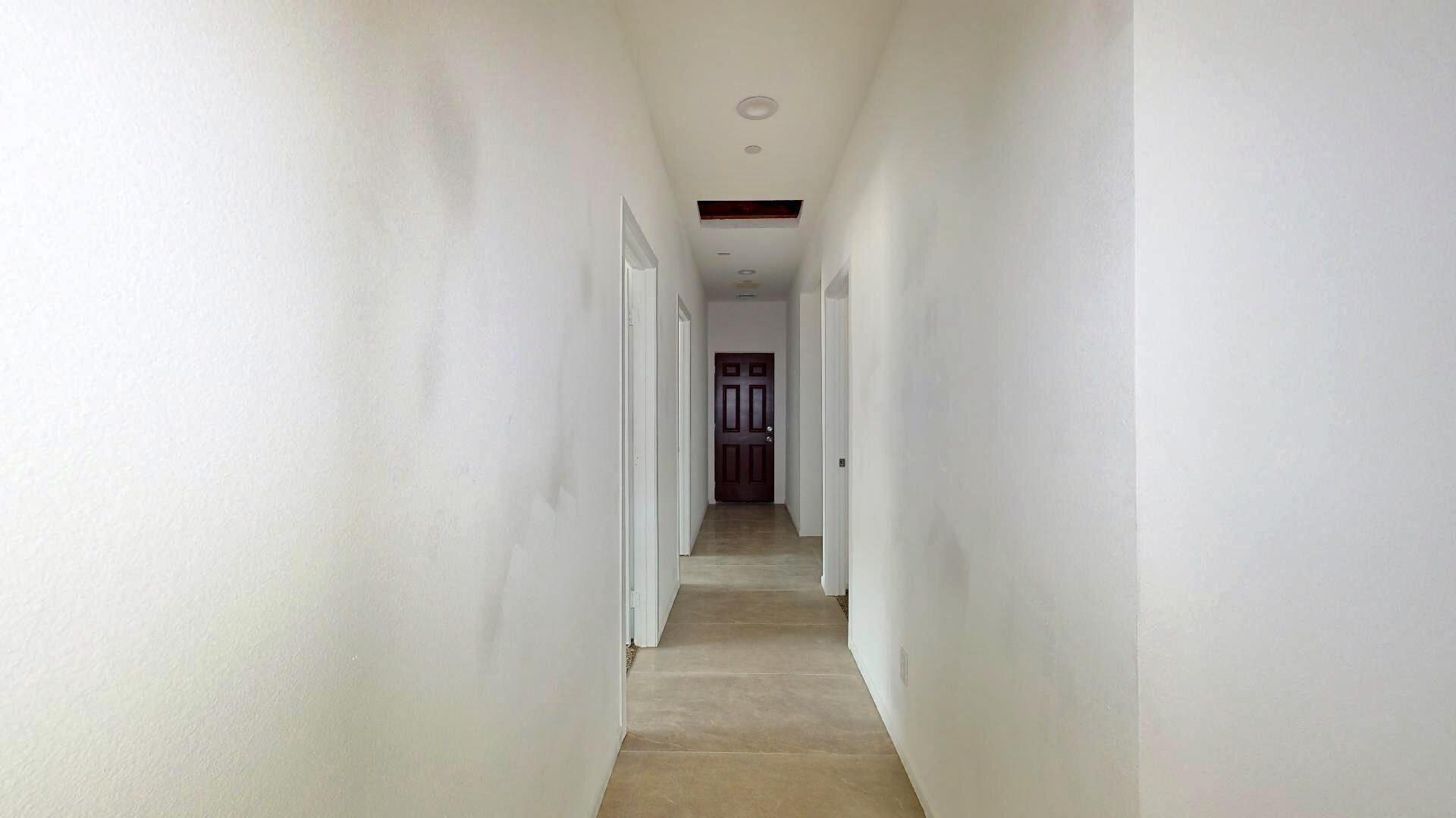 Undisclosed Address Mecca, CA 92254 - Photo 8 of 10 a view of a hallway with wooden shelves