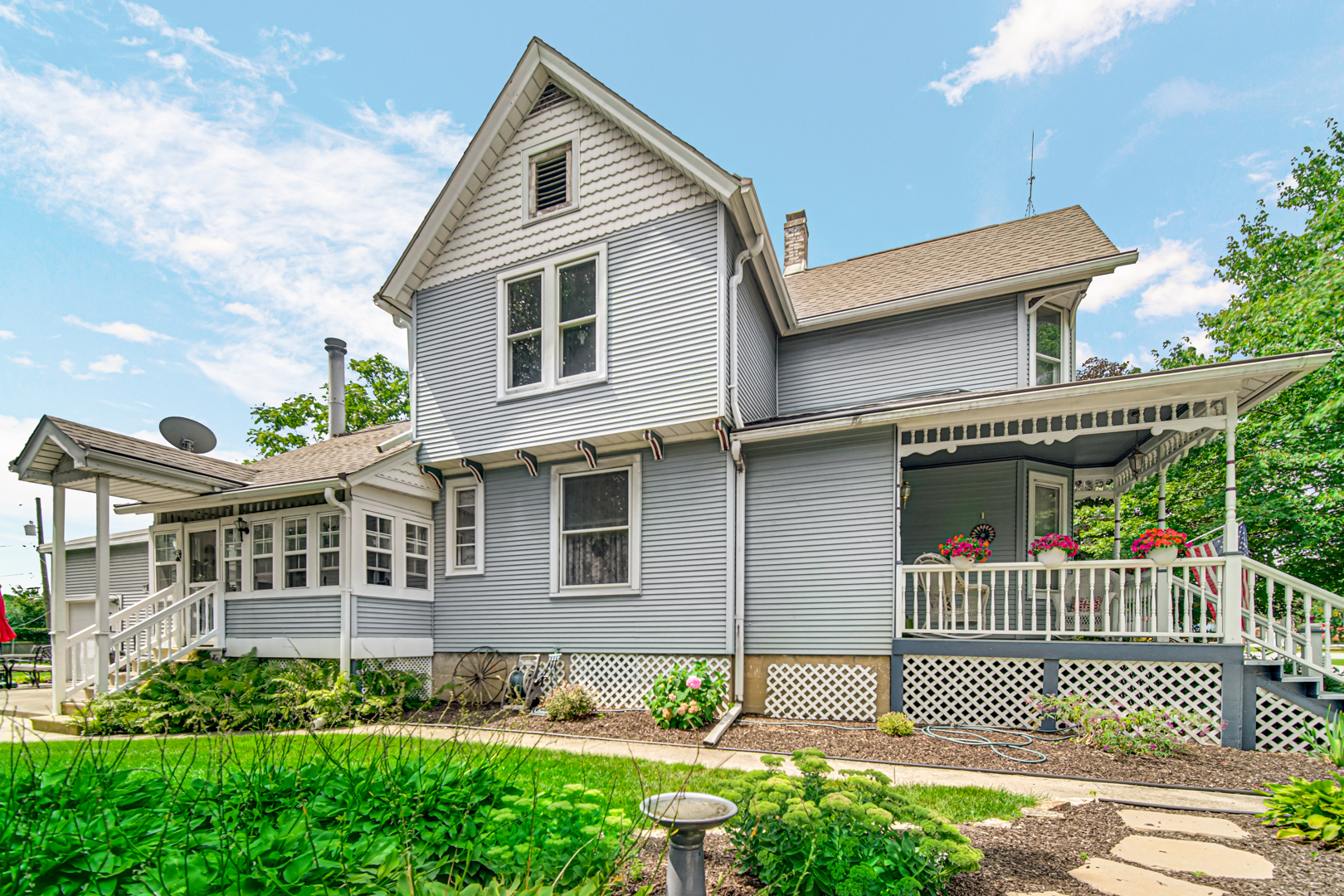 1945 Pine Road Homewood, IL 60430 - Photo 1 of 26 a front view of a house with a garden