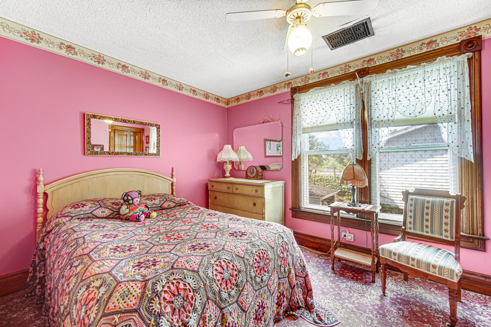 1945 Pine Road Homewood, IL 60430 - Photo 12 of 26 a bedroom with a bed and wooden floor