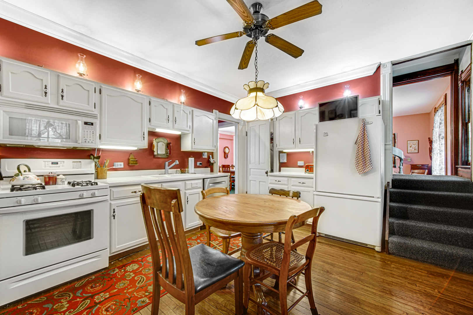 1945 Pine Road Homewood, IL 60430 - Photo 3 of 26 a kitchen with stainless steel appliances kitchen island granite countertop a table chairs and a refrigerator