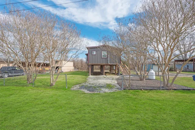 a view of a house with a big yard