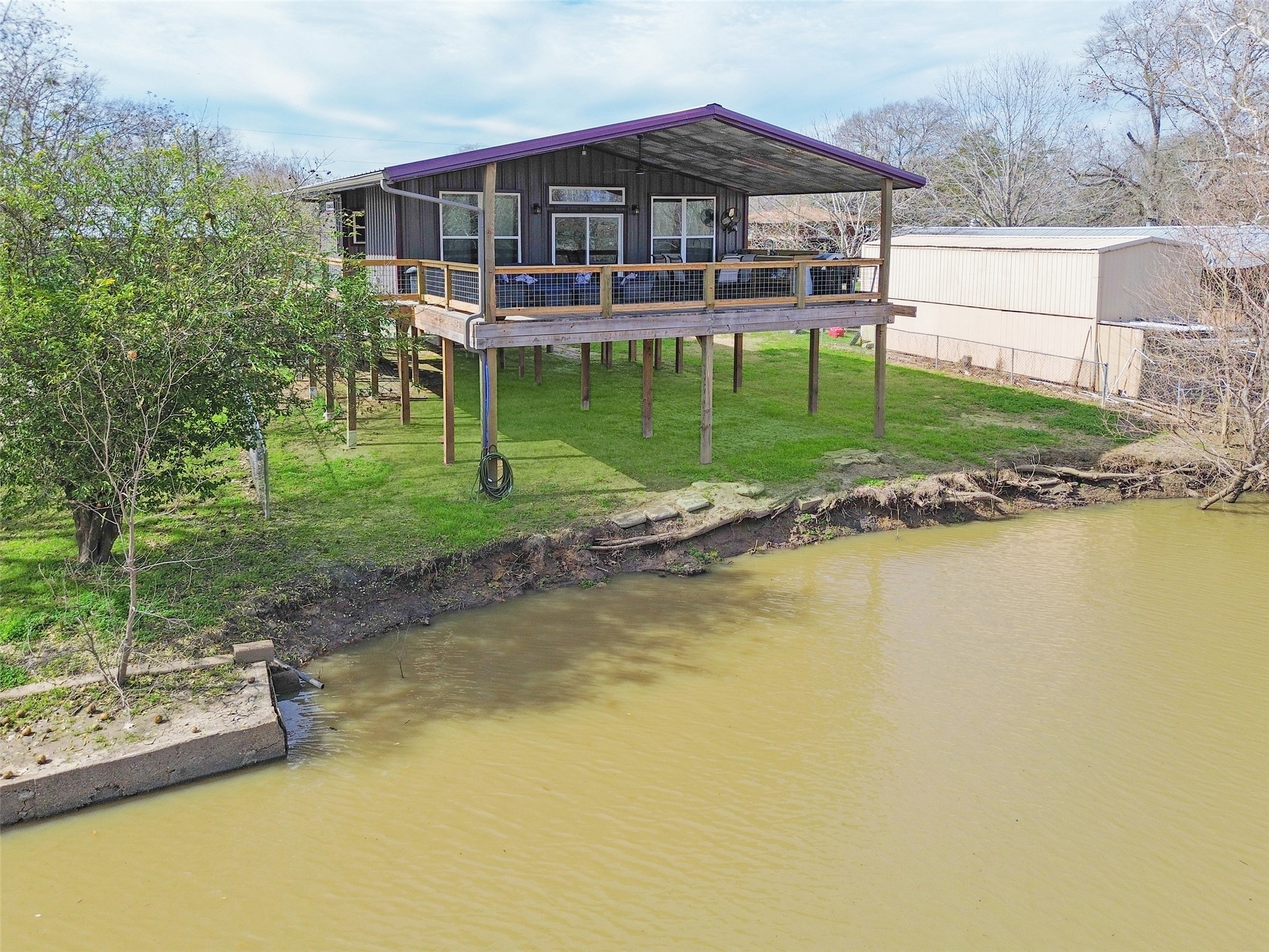 574 River Oaks Drive Trinity, TX 75862 - Photo 2 of 19 a view of a house with a yard patio and swimming pool