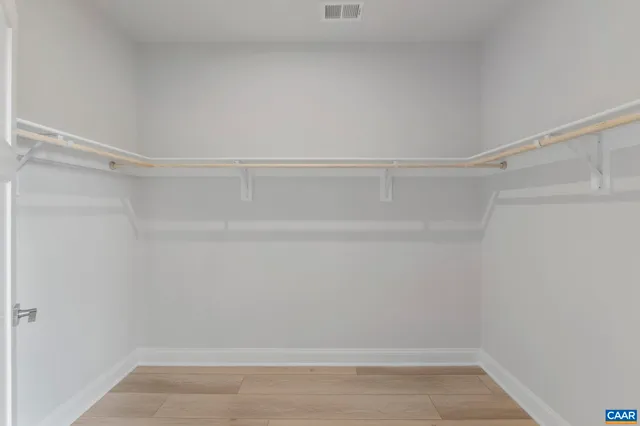 a view of an empty walk in closet