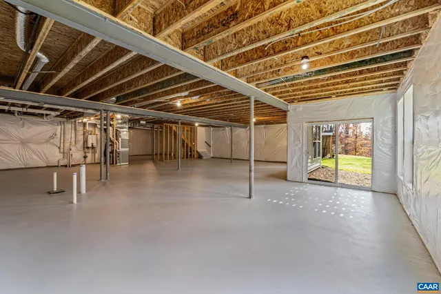 a view of an empty room with glass door
