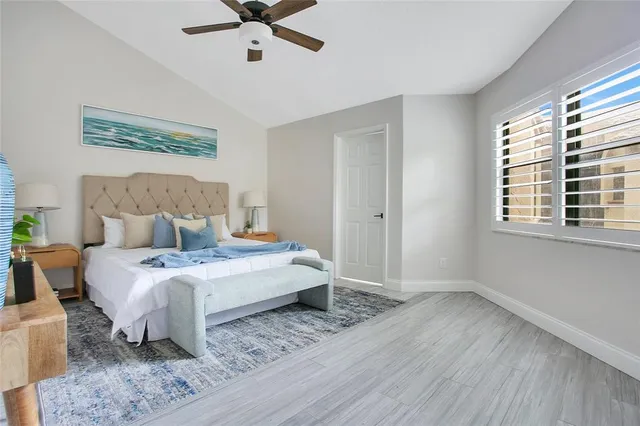 a bedroom with a bed and a table