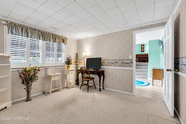 a workspace with furniture and window