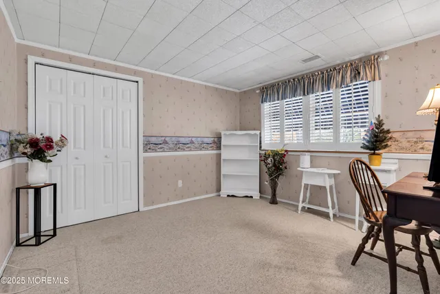 a view of a livingroom with furniture and windows