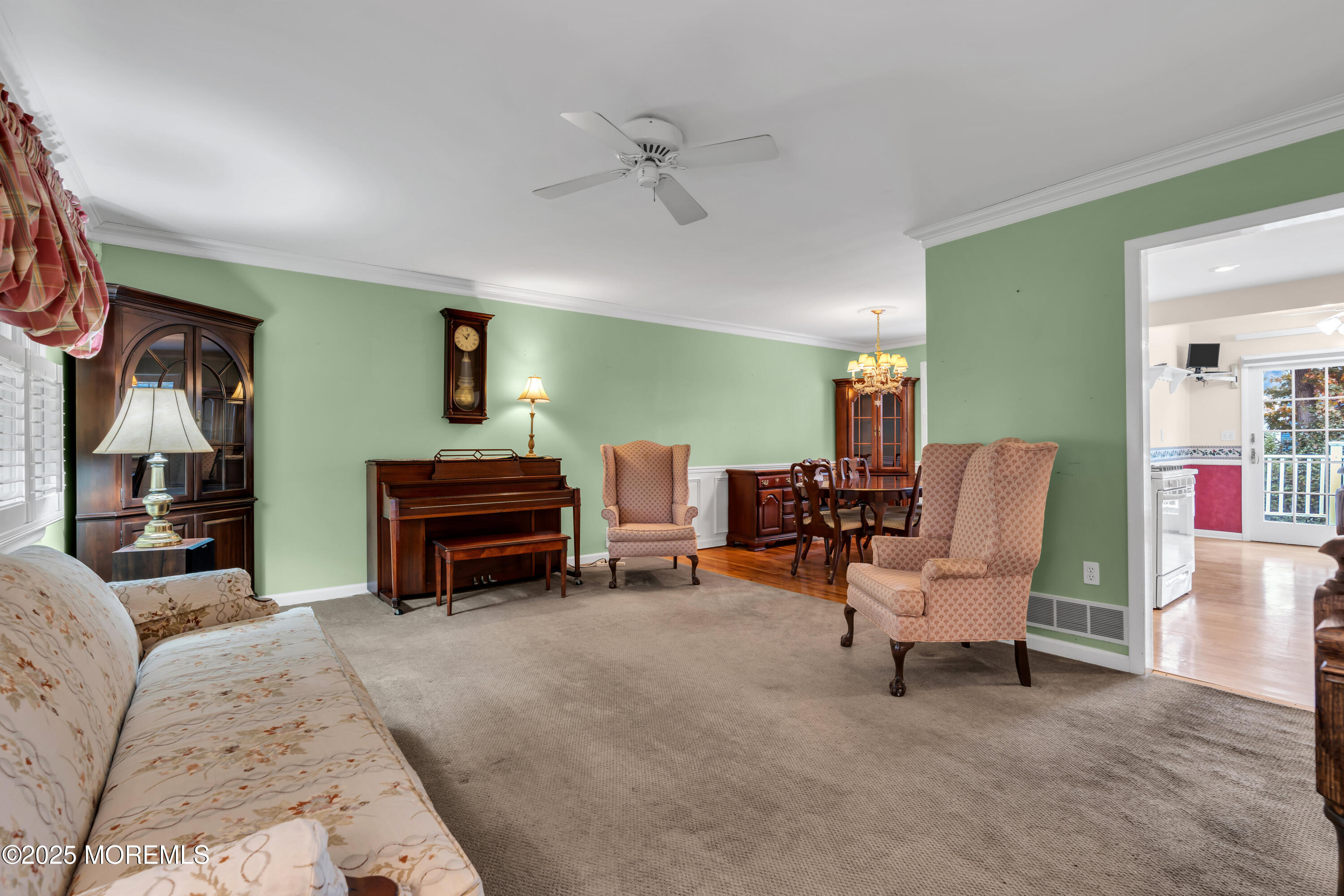 39 Bayberry Lane Middletown, NJ 07748 - Photo 15 of 37 a living room with furniture and a chandelier