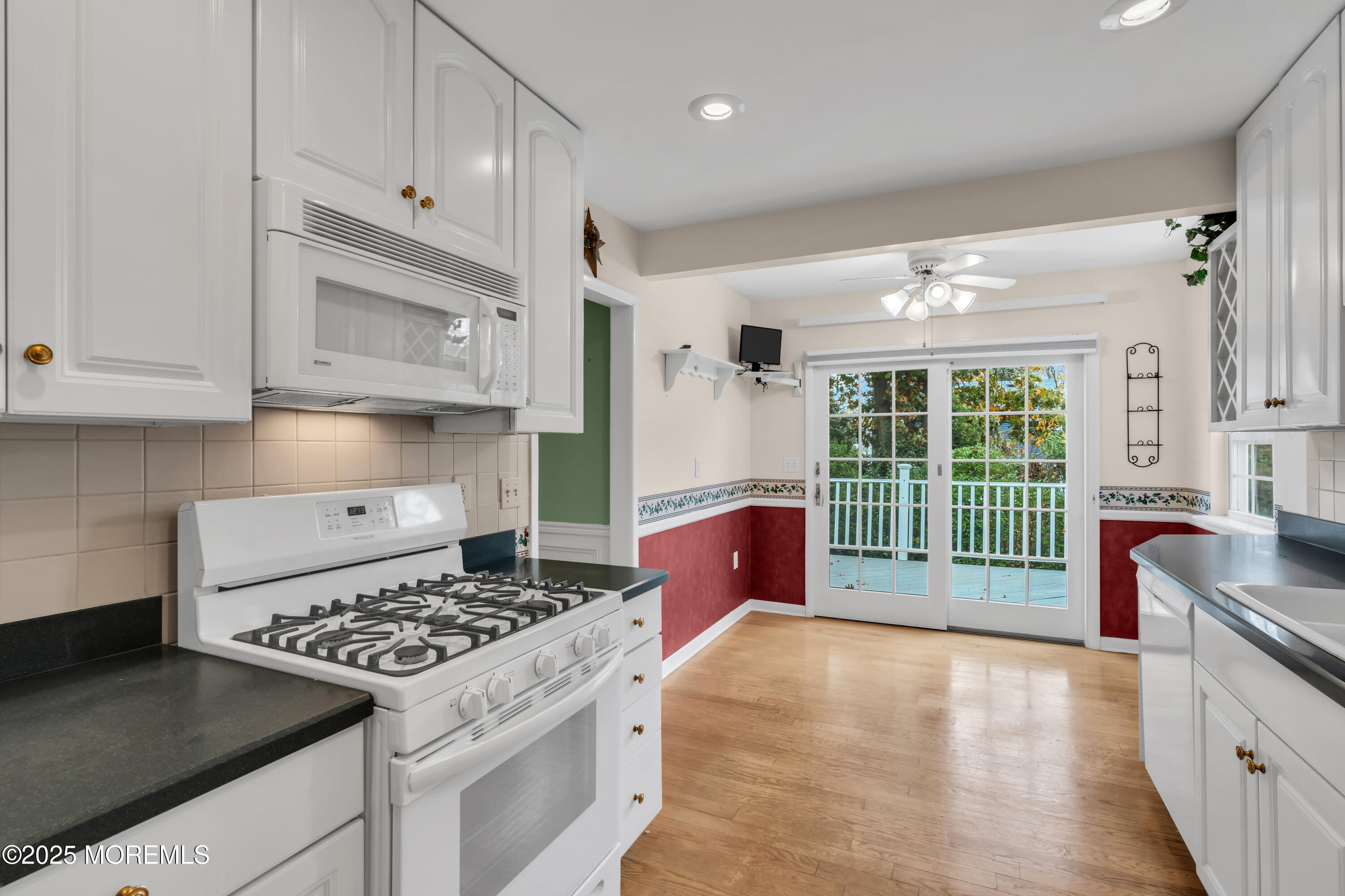 39 Bayberry Lane Middletown, NJ 07748 - Photo 16 of 37 a kitchen with kitchen island a stove a sink and a granite counter tops
