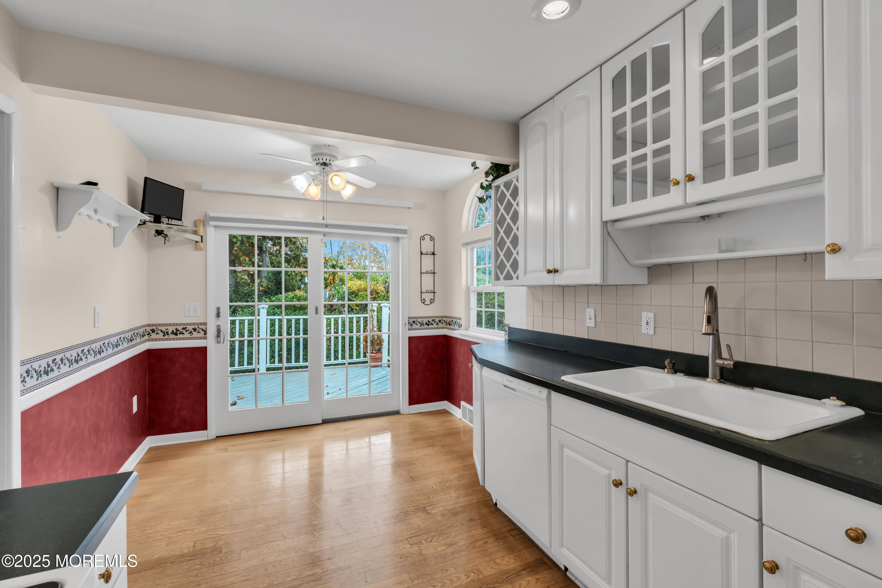 39 Bayberry Lane Middletown, NJ 07748 - Photo 20 of 37 a kitchen with granite countertop a sink and white cabinets
