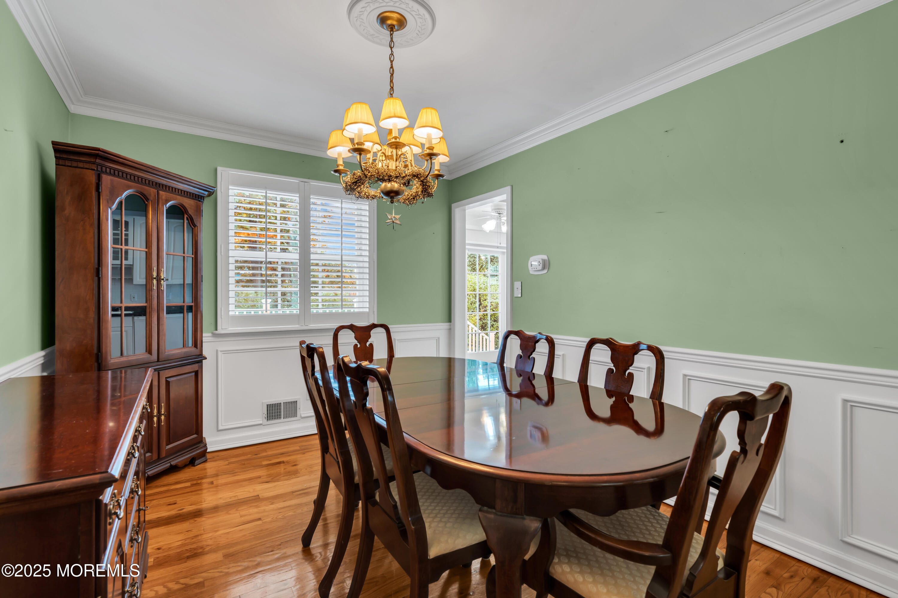 39 Bayberry Lane Middletown, NJ 07748 - Photo 23 of 37 a view of a dining room with furniture wooden floor and chandelier