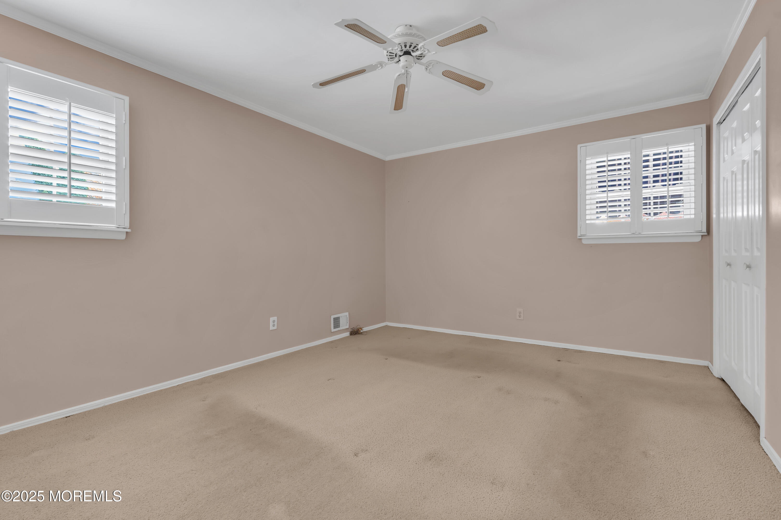 39 Bayberry Lane Middletown, NJ 07748 - Photo 25 of 37 an empty room with windows and fan