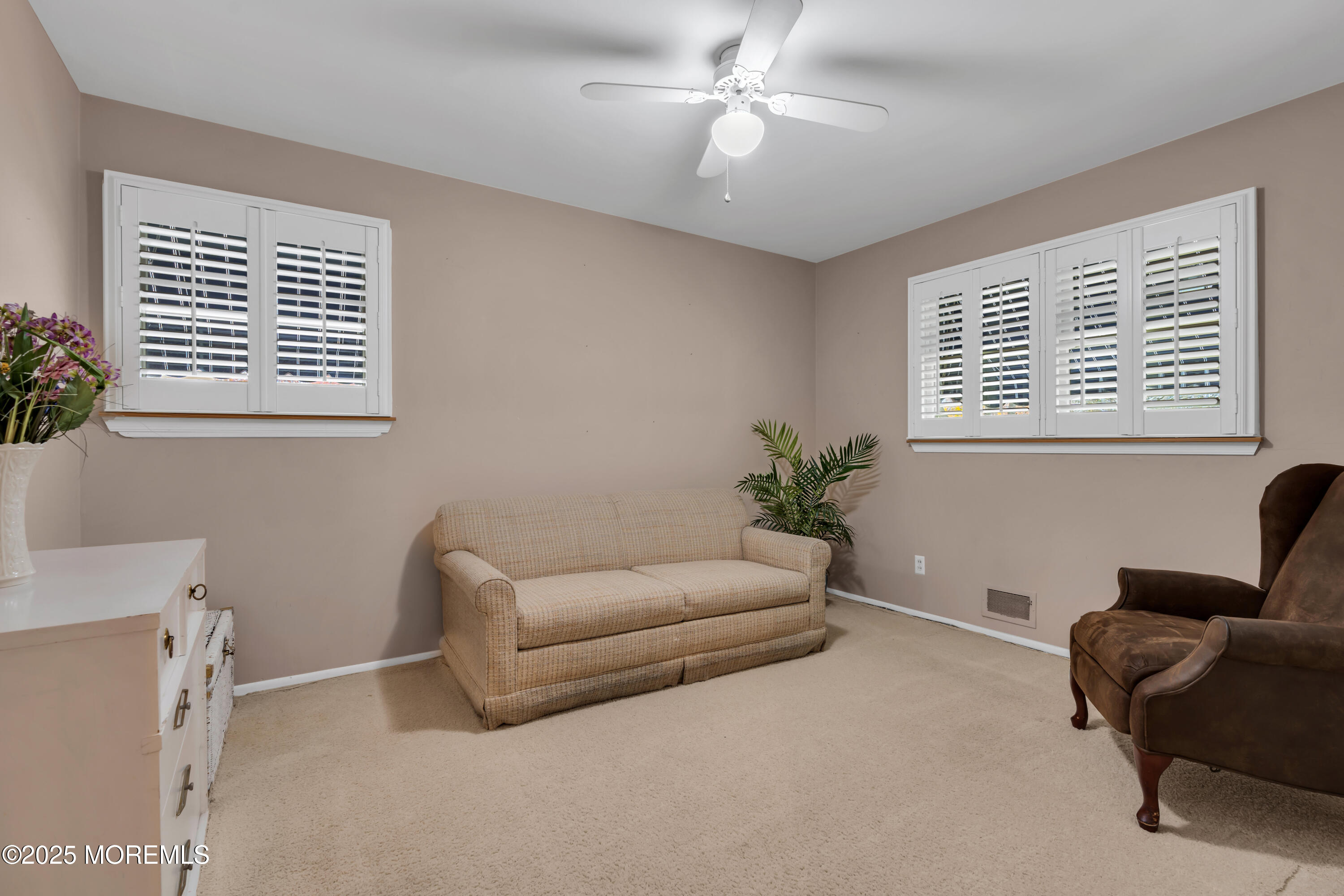 39 Bayberry Lane Middletown, NJ 07748 - Photo 27 of 37 a living room with furniture and a window