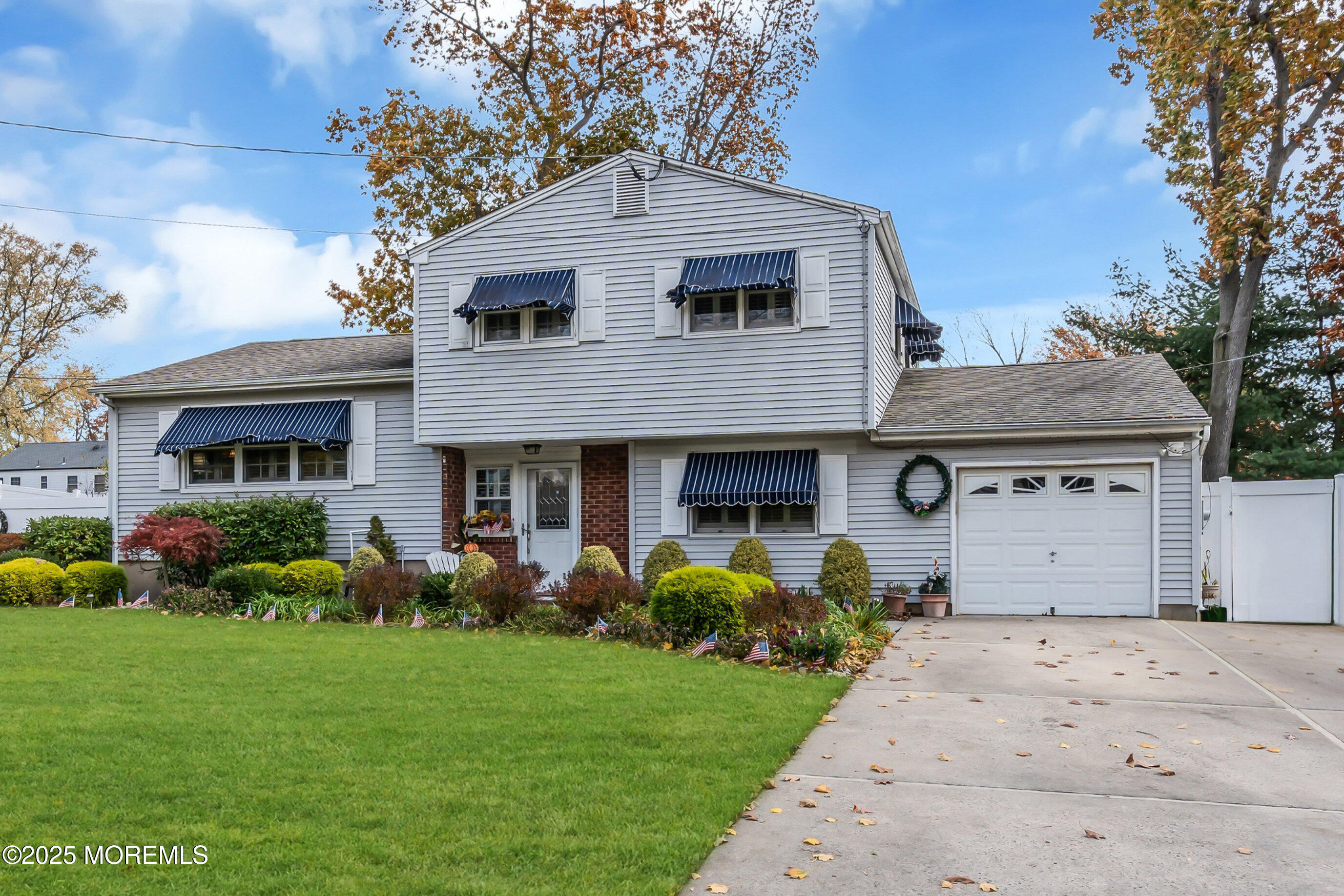 39 Bayberry Lane Middletown, NJ 07748 - Photo 3 of 37 a front view of a house with a garden