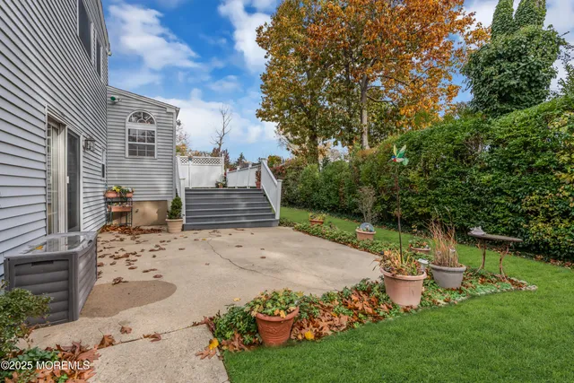a view of a backyard with sitting area