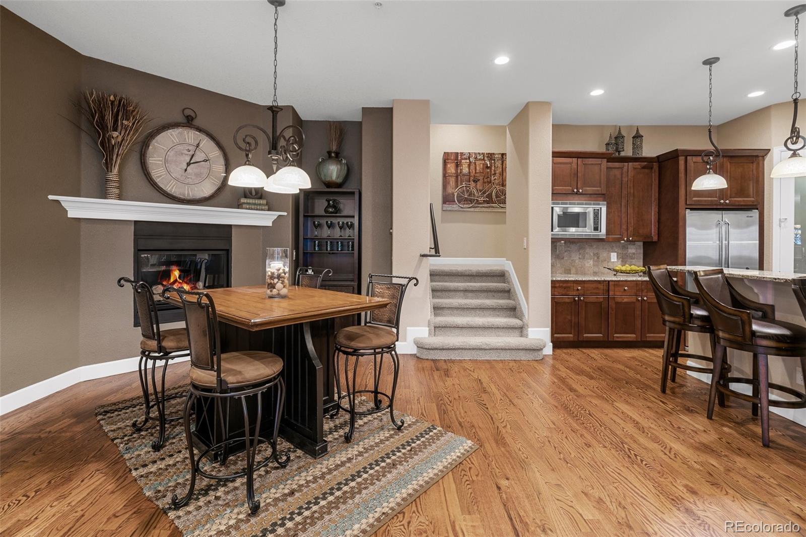 4315 Chateau Ridge Road Castle Rock, CO 80108 - Photo 12 of 26 a view of a a dining room with furniture window and wooden floor