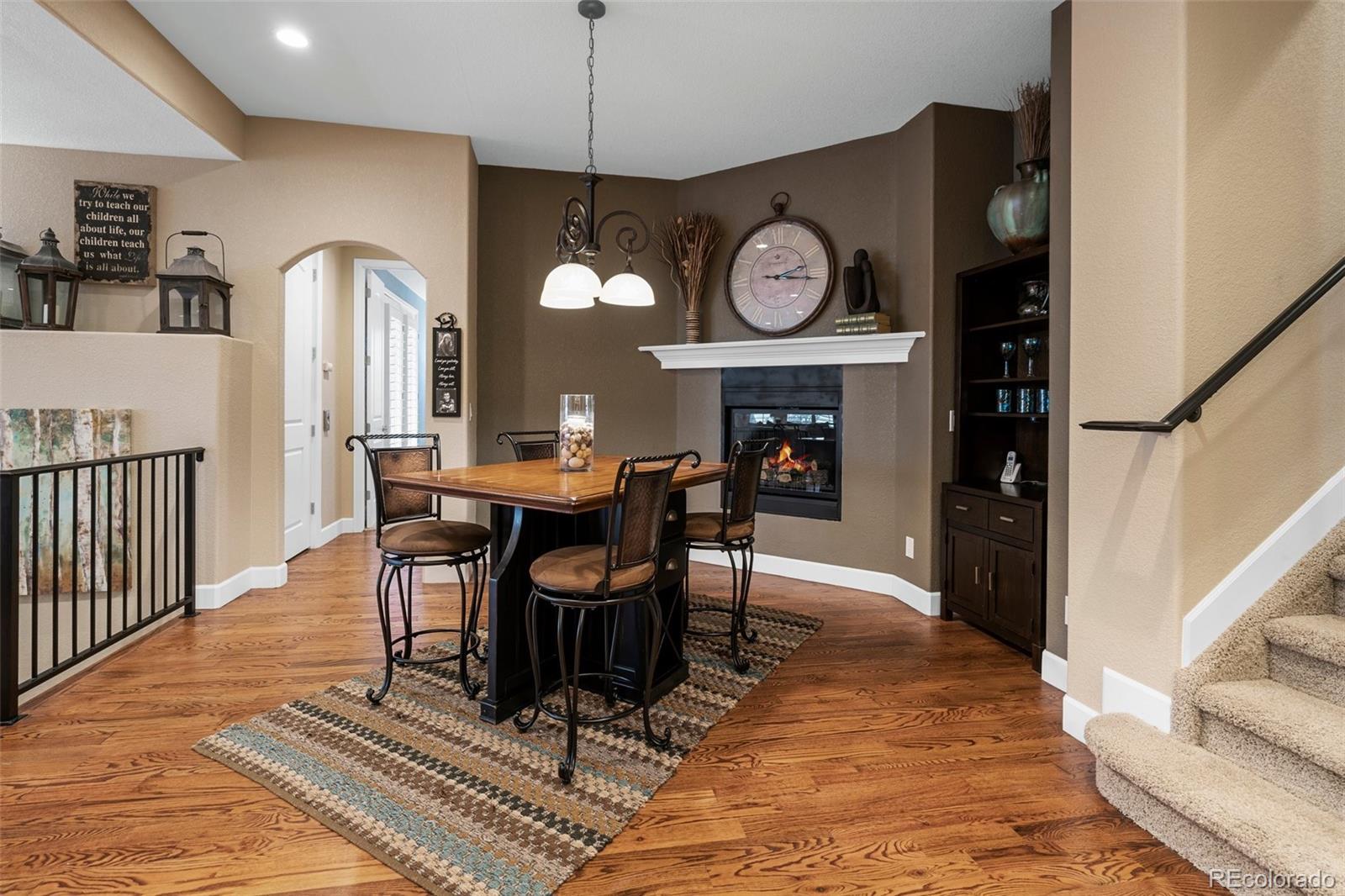 4315 Chateau Ridge Road Castle Rock, CO 80108 - Photo 13 of 26 a view of a a dining room with furniture window and wooden floor