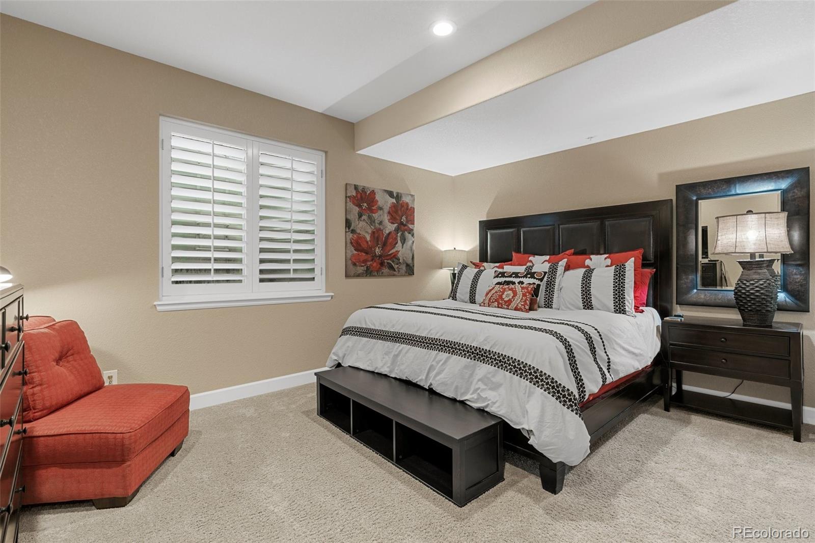 4315 Chateau Ridge Road Castle Rock, CO 80108 - Photo 21 of 26 a spacious bedroom with a bed and a couch