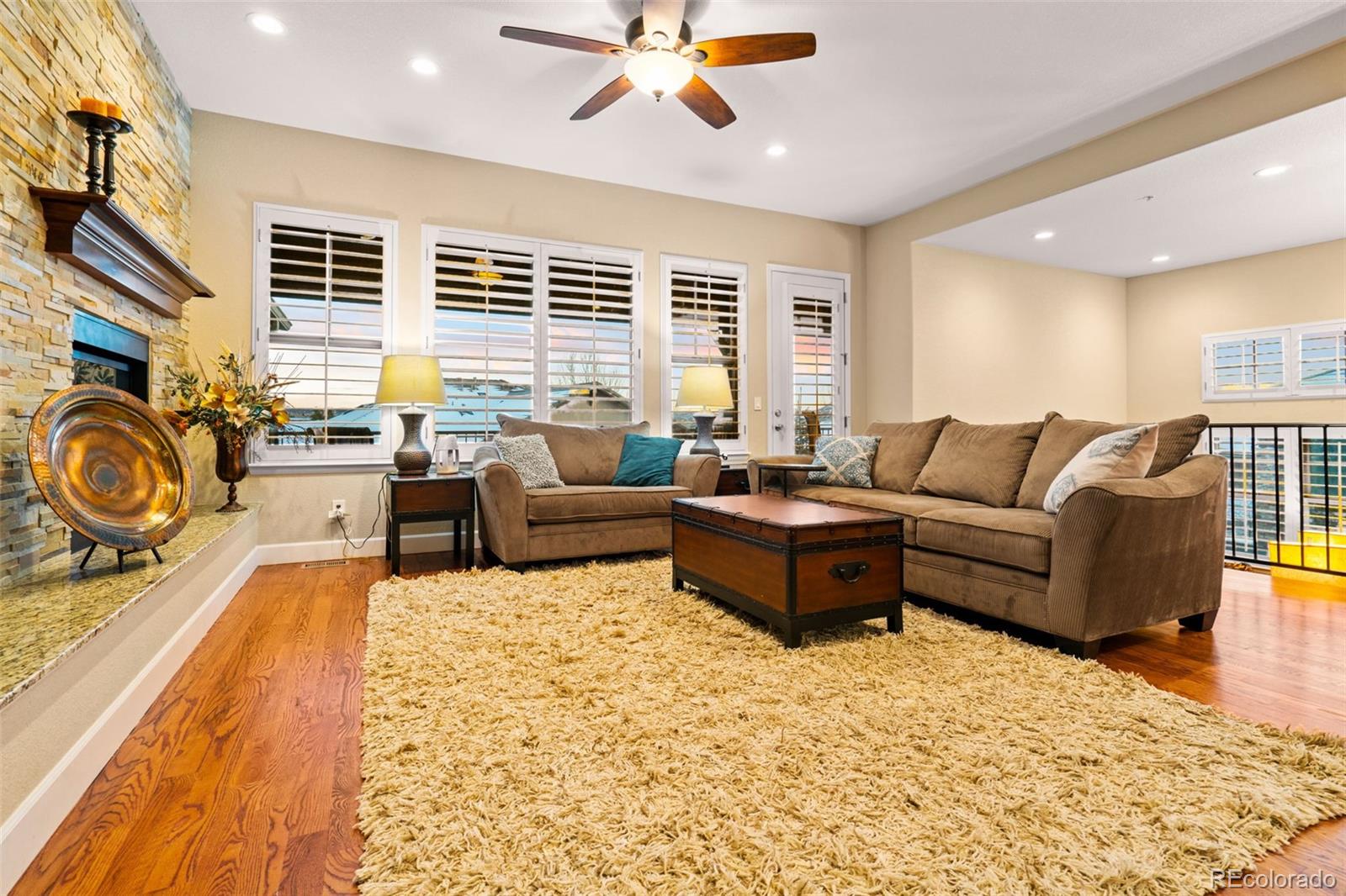 4315 Chateau Ridge Road Castle Rock, CO 80108 - Photo 22 of 26 a living room with furniture and a large window
