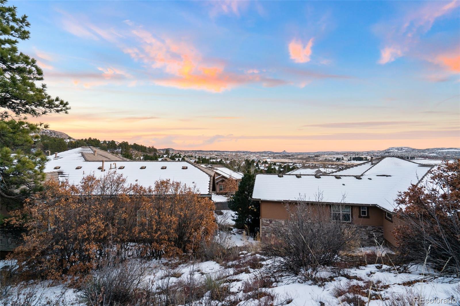 4315 Chateau Ridge Road Castle Rock, CO 80108 - Photo 25 of 26 a view of a city with mountain