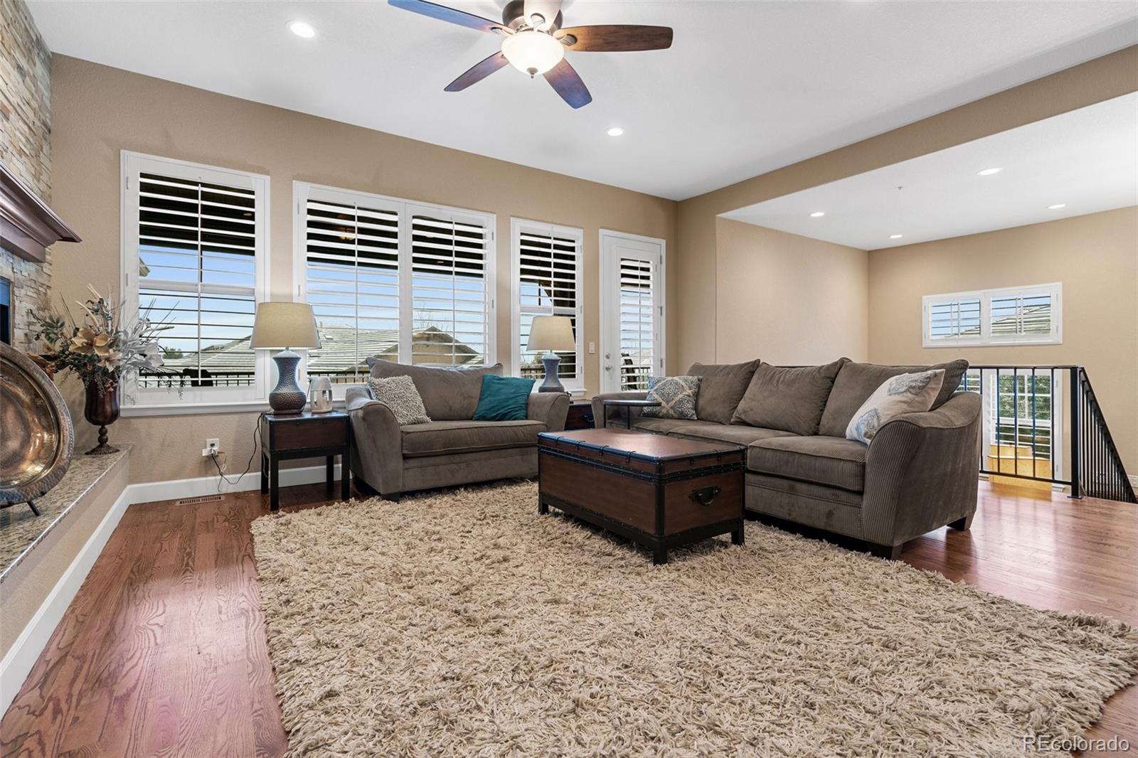 4315 Chateau Ridge Road Castle Rock, CO 80108 - Photo 5 of 26 a living room with furniture and a large window