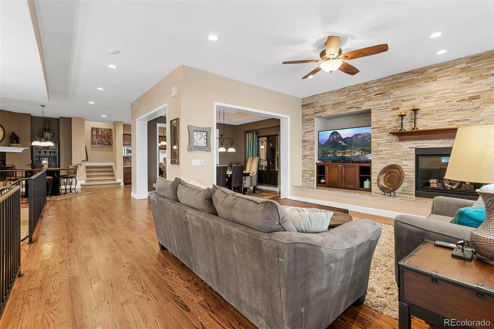4315 Chateau Ridge Road Castle Rock, CO 80108 - Photo 6 of 26 a living room with furniture and a fireplace