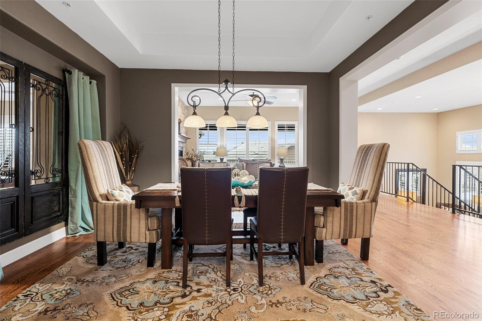 4315 Chateau Ridge Road Castle Rock, CO 80108 - Photo 8 of 26 a view of a dining room with furniture window and wooden floor