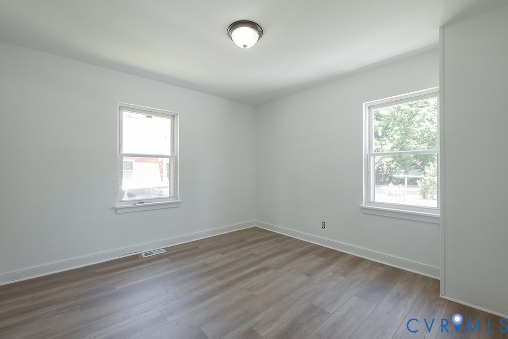 3400 Ryburn Road Richmond, VA 23234 - Photo 23 of 45 Light-filled room featuring wood-finish flooring,