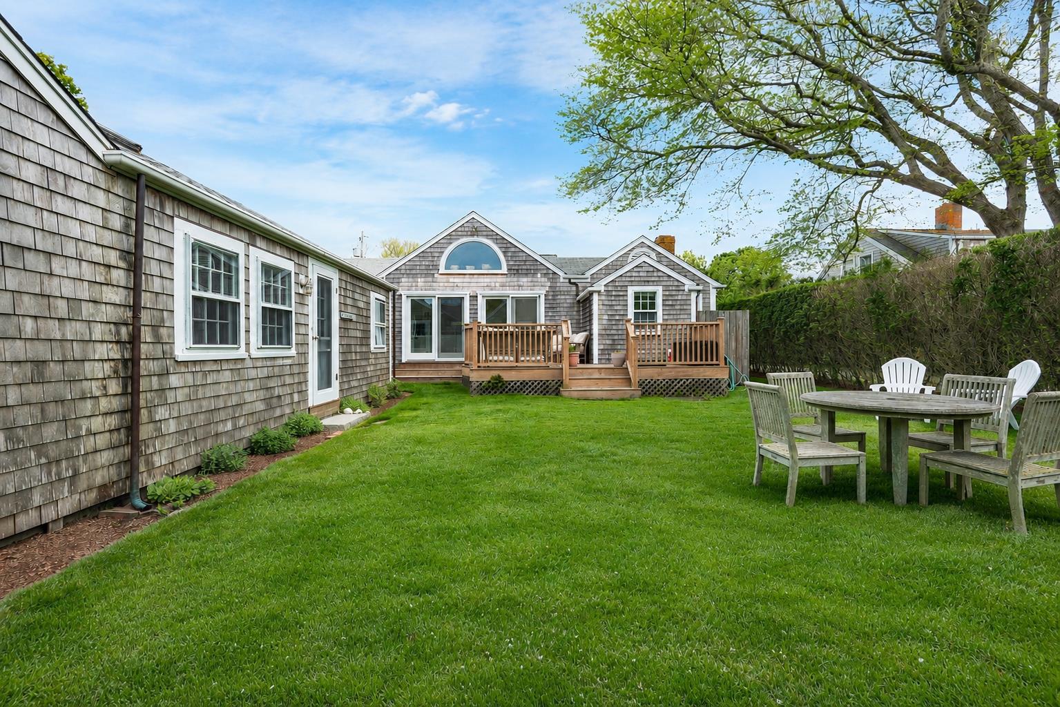 12 King Street Nantucket, MA 02554 - Photo 32 of 32 a front view of a house with a garden and trees
