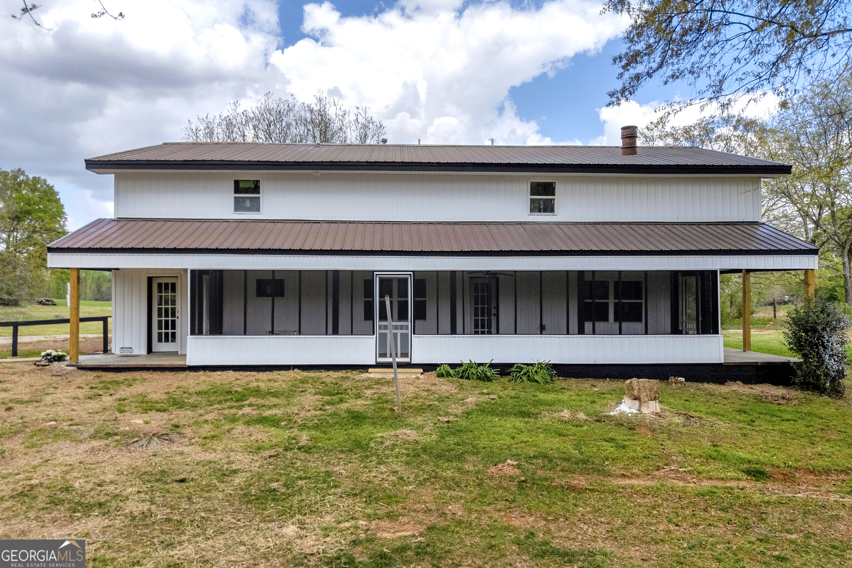 8606 Holly Springs Road Maysville, GA 30558 - Photo 18 of 74 a view of a house with roof deck