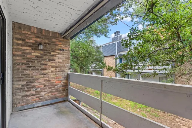 a view of a balcony with an outdoor space