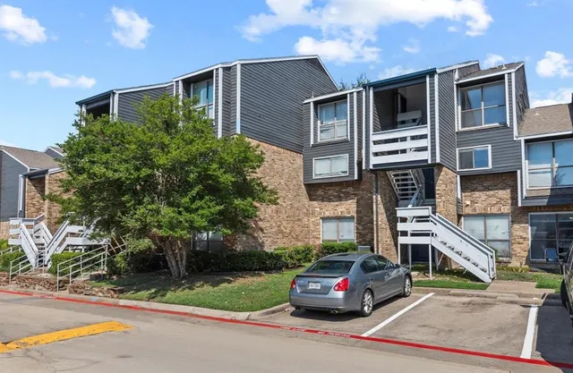a car parked in front of a house