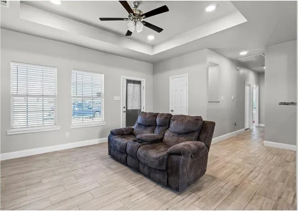a living room with furniture and a window