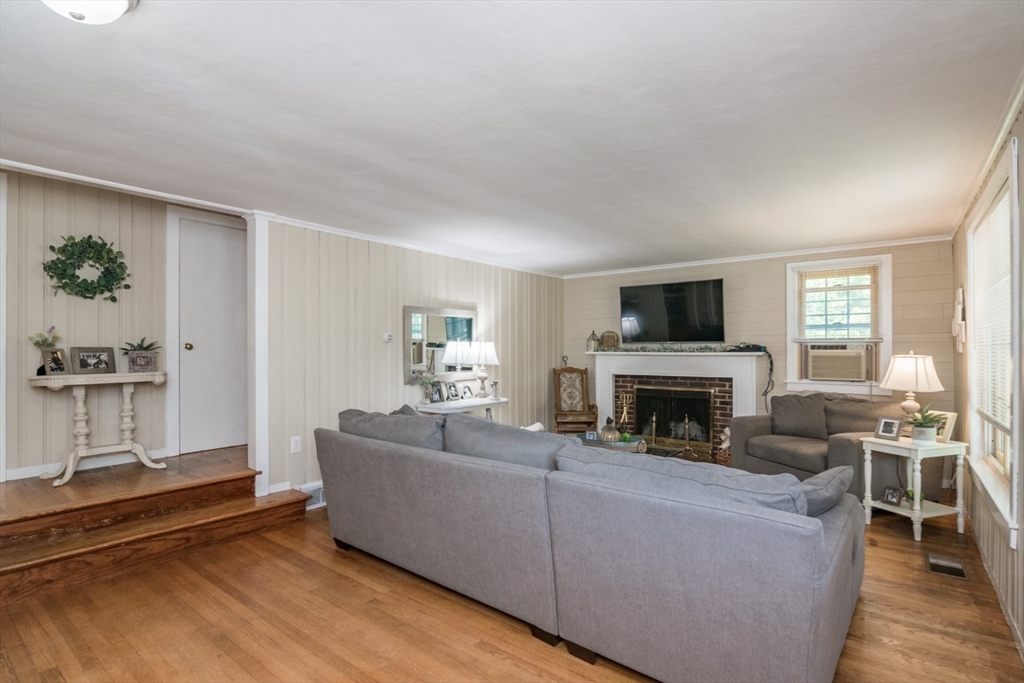 20 Dunton Street Montague, MA 01376 - Photo 19 of 36 a living room with furniture a fireplace and a flat screen tv