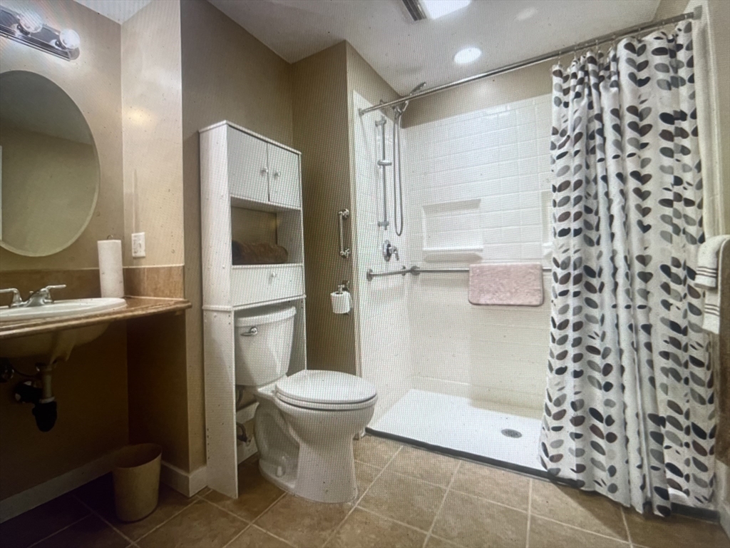 20 Dunton Street Montague, MA 01376 - Photo 20 of 36 a bathroom with a granite countertop sink toilet and shower