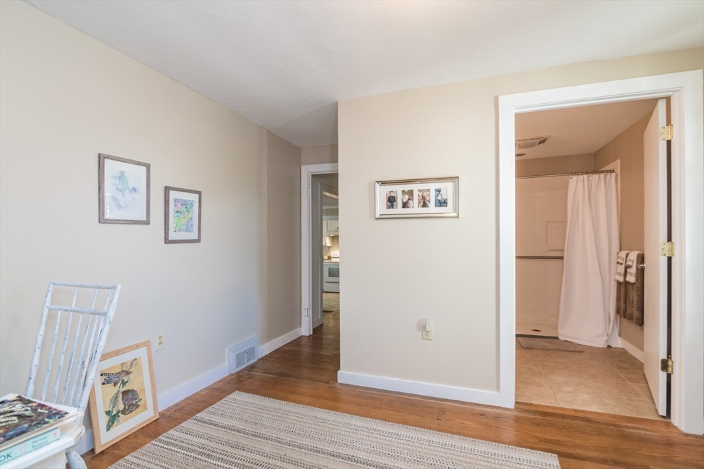 20 Dunton Street Montague, MA 01376 - Photo 22 of 36 a view of a hallway with wooden floor and a bathroom