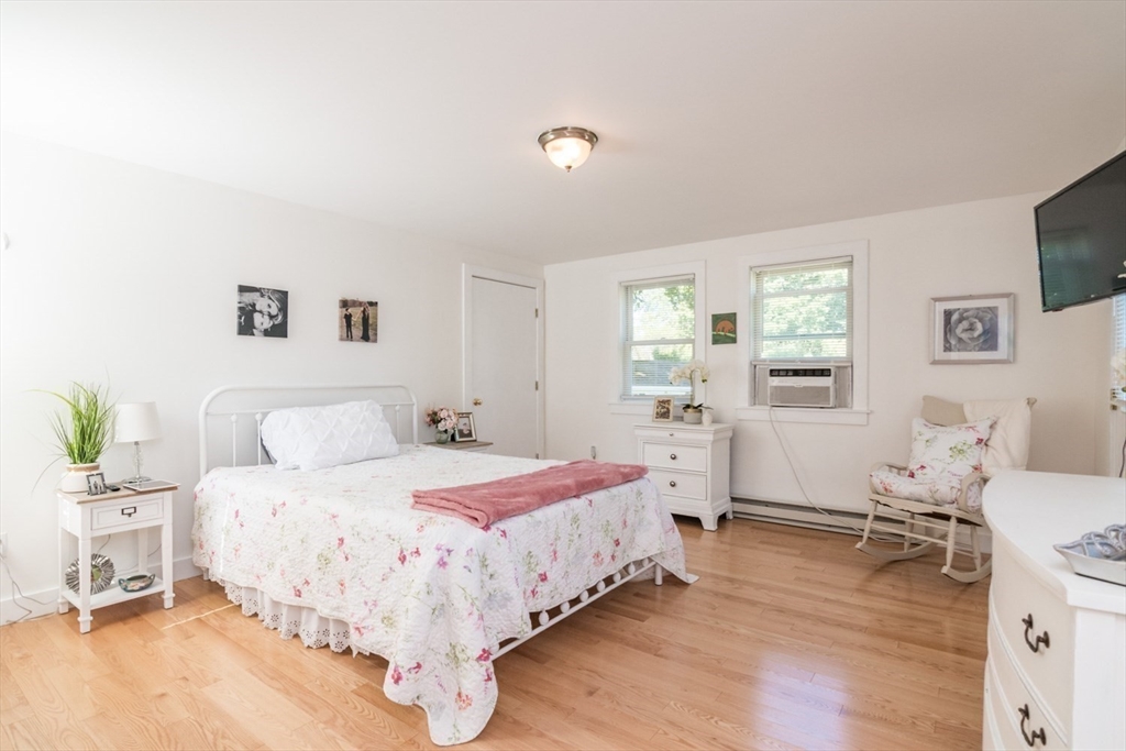 20 Dunton Street Montague, MA 01376 - Photo 24 of 36 a bedroom with a bed and wooden floor