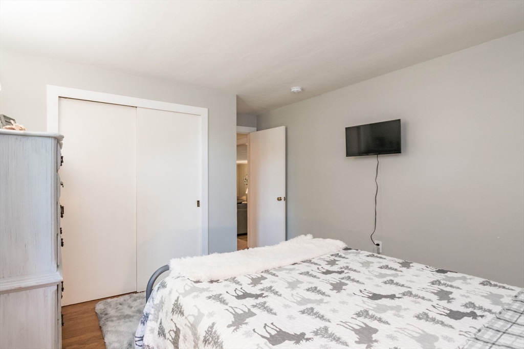 20 Dunton Street Montague, MA 01376 - Photo 29 of 36 a bedroom with a bed and a flat screen tv