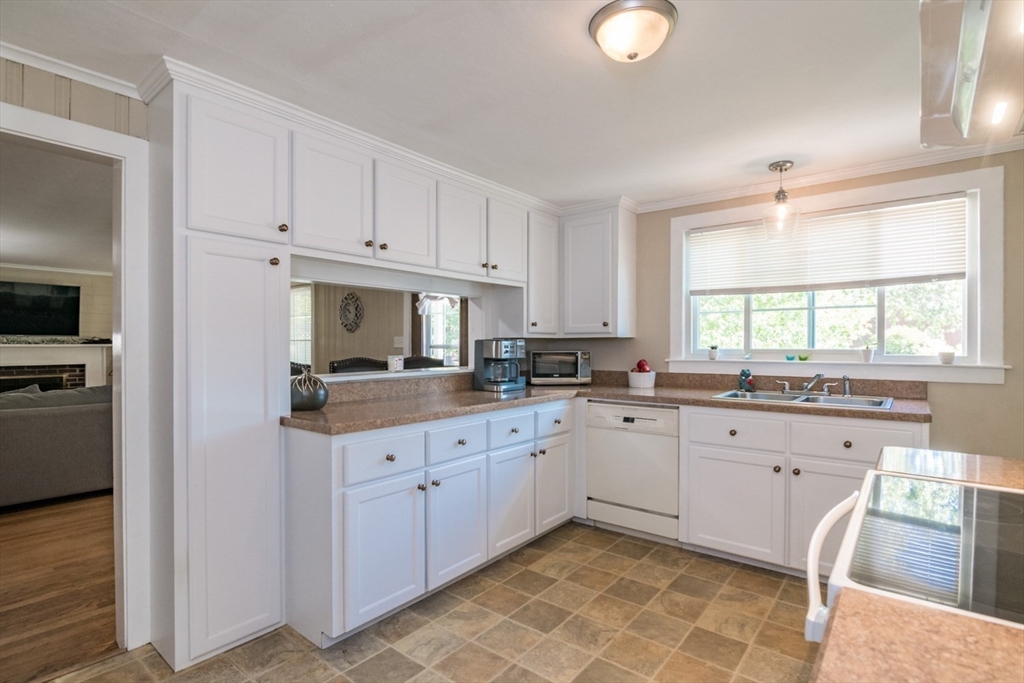 20 Dunton Street Montague, MA 01376 - Photo 9 of 36 a kitchen with granite countertop white cabinets sink and stainless steel appliances