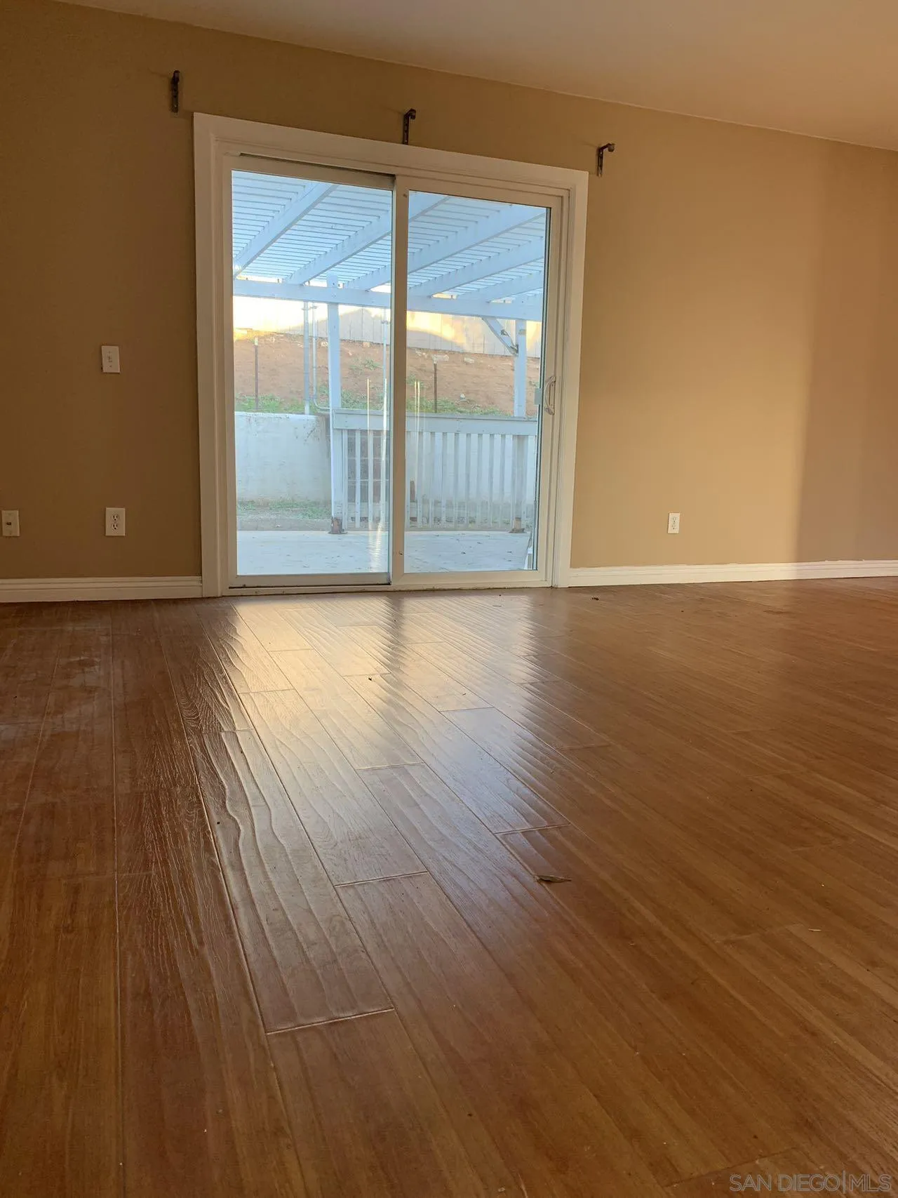 13605 Acton Avenue Poway, CA 92064 - Photo 14 of 18 wooden floor in an empty room with a window