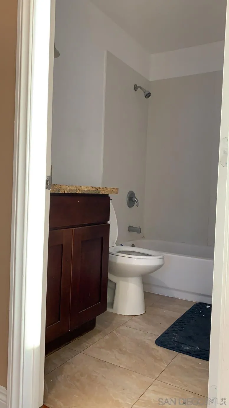 13605 Acton Avenue Poway, CA 92064 - Photo 16 of 18 a bathroom with a toilet and a shower