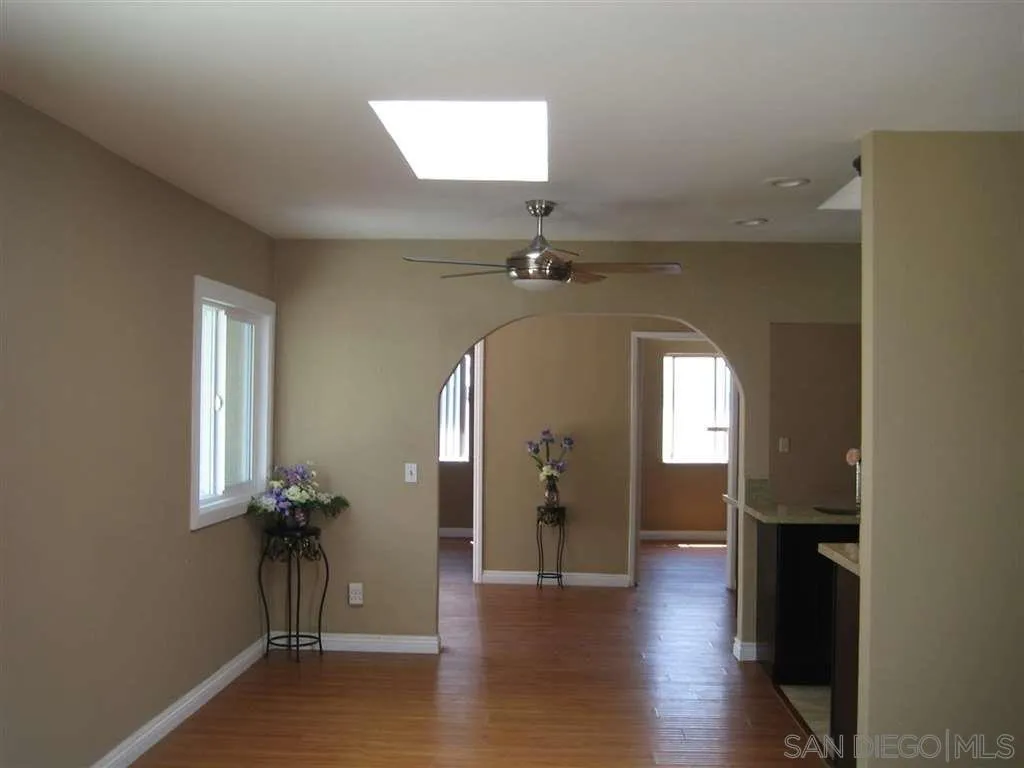 13605 Acton Avenue Poway, CA 92064 - Photo 5 of 18 wooden floor in an empty room with a window
